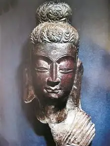 高树龛佛首曲折回家路